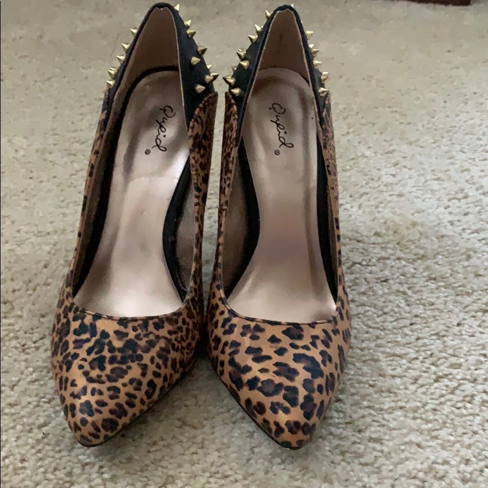 Animal print studded pointy toe heels.